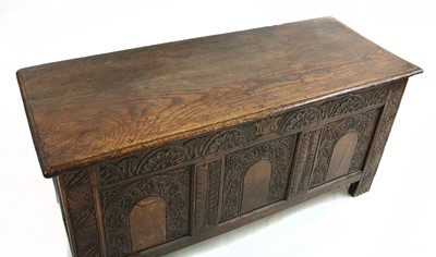 Lot 501 - A late 17th century and later carved oak coffer