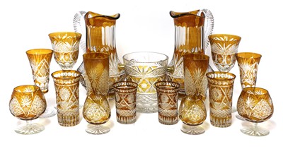 Lot 866 - An unusual composite Bohemian amber flash cut-glass table service