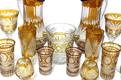 Lot 866 - An unusual composite Bohemian amber flash cut-glass table service