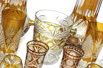Lot 866 - An unusual composite Bohemian amber flash cut-glass table service