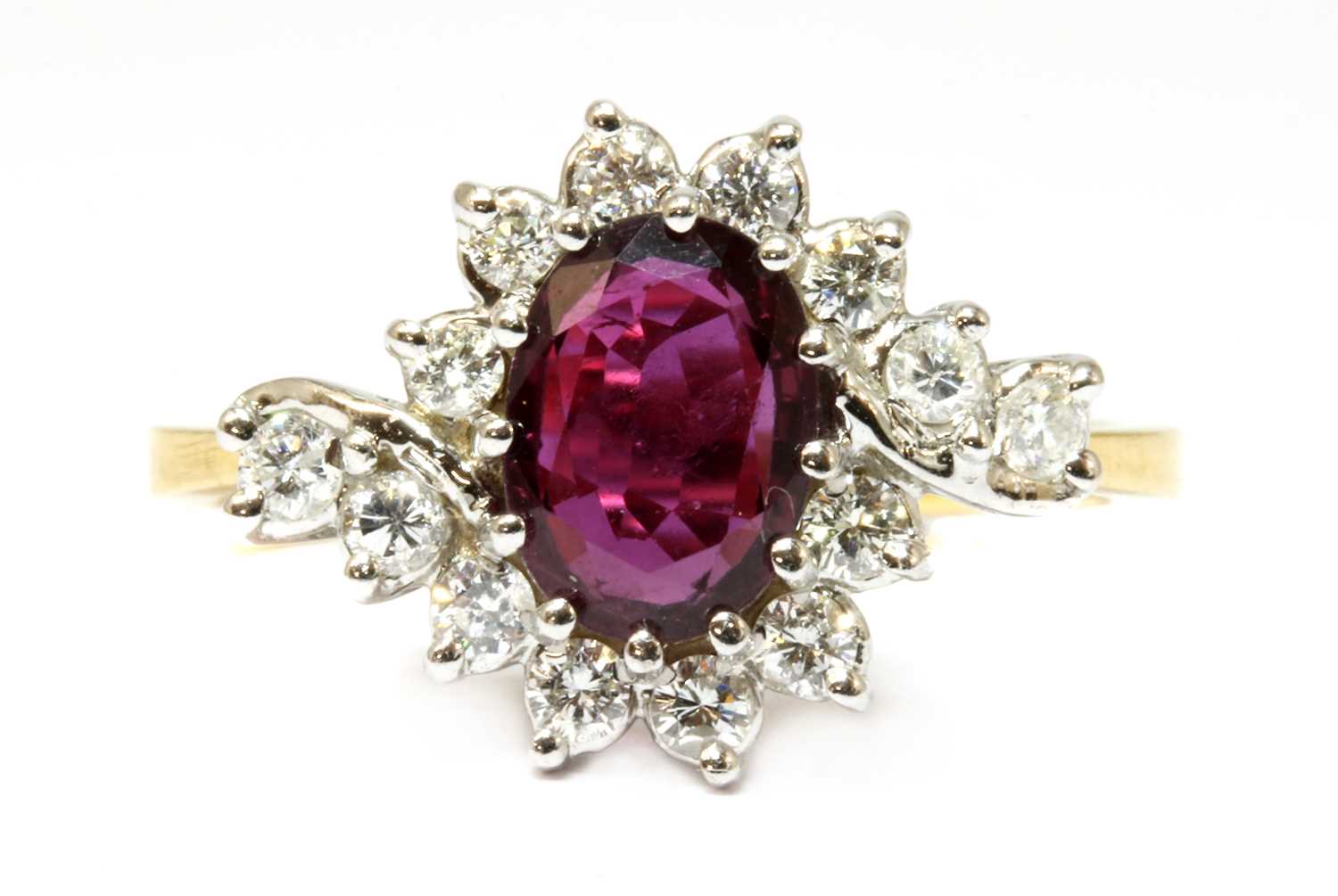 Lot 39 - An 18ct gold ruby and diamond crossover cluster ring