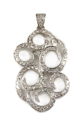 Lot 378 - A white gold diamond set scrolling pendant