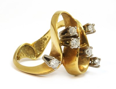 Lot 52 - A gold diamond set wave head ring, c.1970
