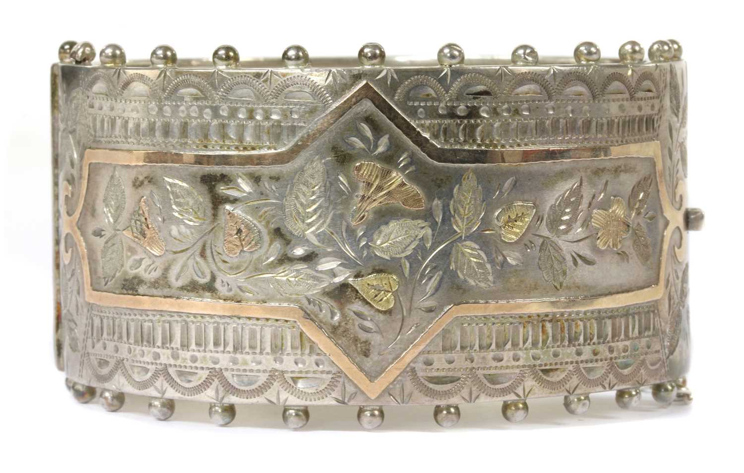 Lot 23 - A late Victorian sterling silver hinged bangle