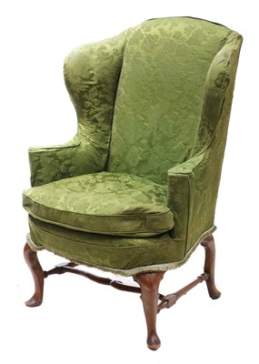Lot 362 - A walnut framed wingback armchair