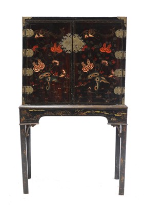 Lot 806 - A Chinese black lacquered and gilt metal mounted cabinet on stand
