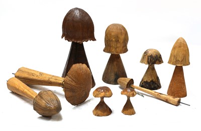Lot 145P - A collection of eight carved wooden mushrooms