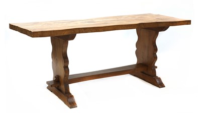 Lot 122 - An elm and walnut trestle table
