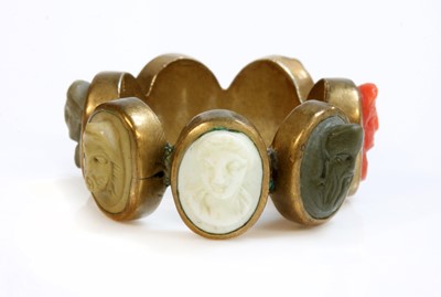 Lot 8 - A late Georgian gilt metal specimen lava and coral cameo ring