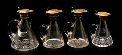 Lot 112 - Four silver mounted whisky noggins