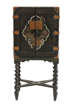 Lot 572 - A Japanese cabinet on an associated stand