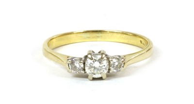 Lot 156 - An 18ct gold three stone diamond ring