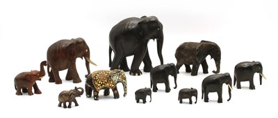 Lot 243 - A large collection of model elephants