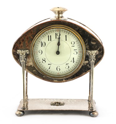 Lot 120 - An Arts and Crafts silver-plated desk clock