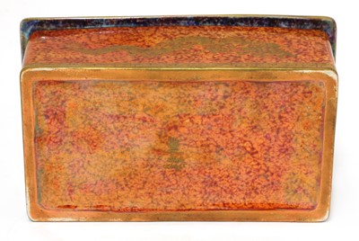 Lot 375 - A Wedgwood 'Celestial Dragon' orange lustre cigarette box and cover