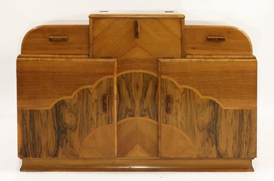 Lot 537 - An Art Deco walnut 'cloud' sideboard