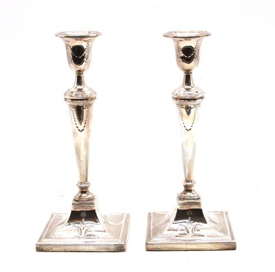 Lot 109 - A pair of silver candlesticks
