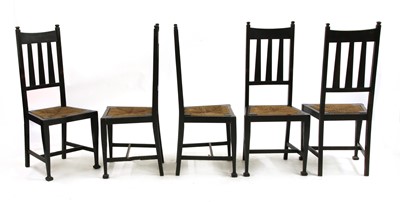 Lot 165 - A set of five Arts and Crafts oak and ebonised chairs