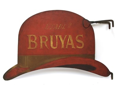 Lot 717 - A red painted iron milliner's trade sign