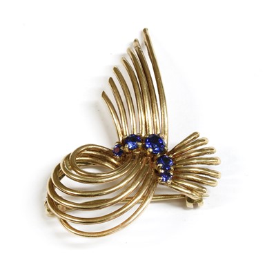 Lot 86 - A 9ct gold synthetic sapphire spray brooch, c.1960