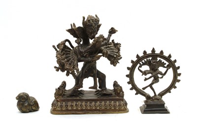 Lot 177 - An Indian bronze group of a dancing girl and a mythical creature