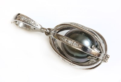 Lot 222 - A platinum Tahitian cultured pearl and diamond 'Engage' pendant by Theo Fabergé
