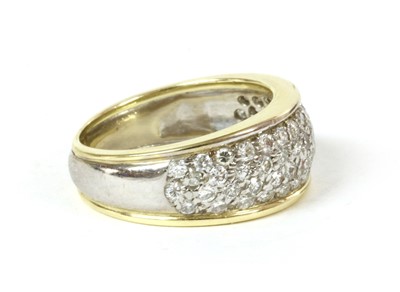 Lot 148 - A gold and white gold pavé set diamond ring