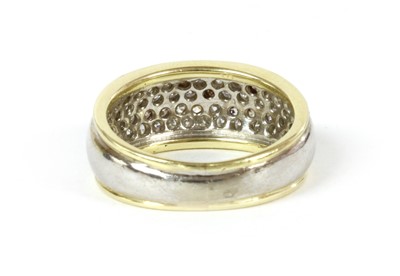 Lot 148 - A gold and white gold pavé set diamond ring