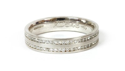 Lot 144 - An 18ct white gold diamond set wedding ring