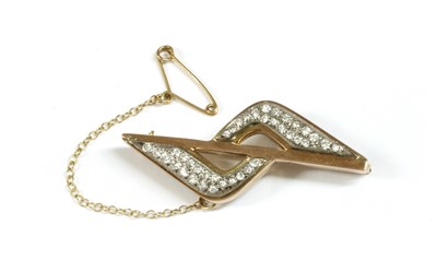 Lot 151 - A gold diamond set brooch
