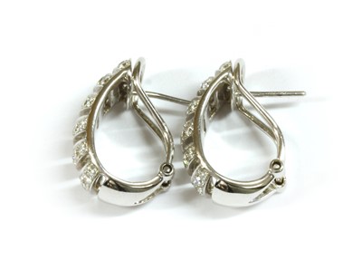 Lot 139 - A pair of 18ct white gold diamond set half hoop earrings