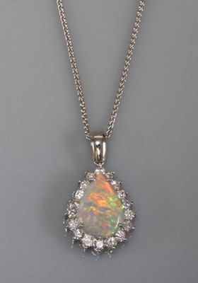 Lot 169 - A white gold opal and diamond pear-shaped cluster pendant