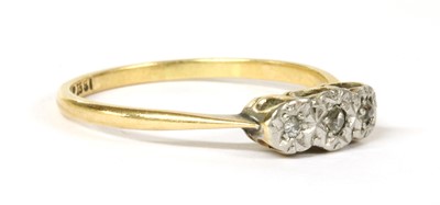 Lot 159 - A gold three stone diamond ring