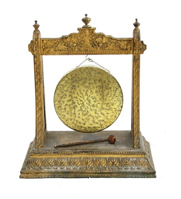 Lot 538 - A brass gong on a gilded and carved wooden stand