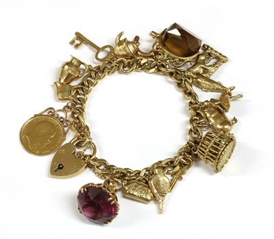 Lot 123 - A gold charm bracelet