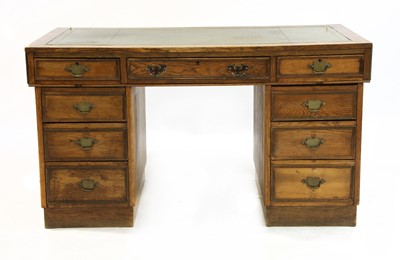 Lot 503 - A 20th century oak pedestal desk