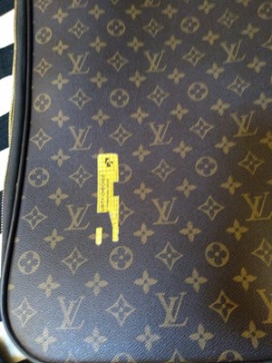 Lot 111 - A Louis Vuitton monogrammed canvas 'Pégase Légère 65' suitcase