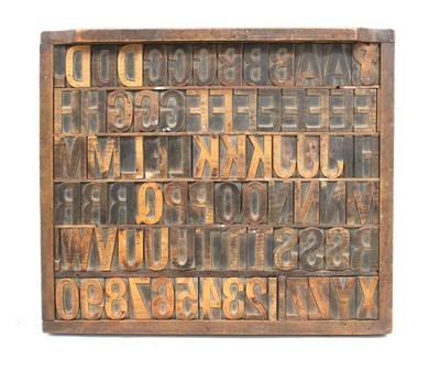 Lot 187 - A collection of early 20th century printer's blocks and tray