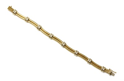 Lot 249 - An Italian two colour gold wavy link bracelet