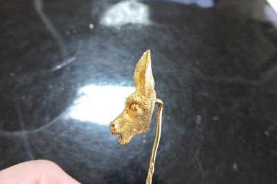 Lot 57 - A gold donkey or ass novelty stick pin, late 19th century or early 20th century