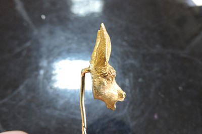 Lot 57 - A gold donkey or ass novelty stick pin, late 19th century or early 20th century