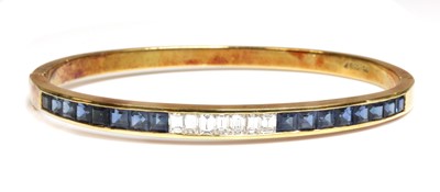 Lot 303 - A diamond and sapphire gold hinged bangle