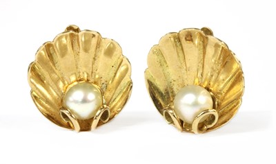 Lot 311 - A pair of gold pearl set clam shell form clip earrings