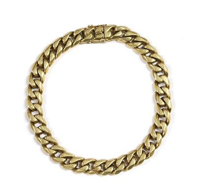 Lot 440 - A gold curb link bracelet