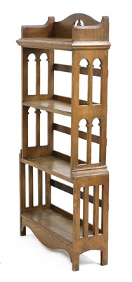 Lot 185 - An Arts and Crafts oak four-tier open bookcase
