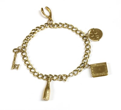 Lot 124 - A 9ct gold charm bracelet