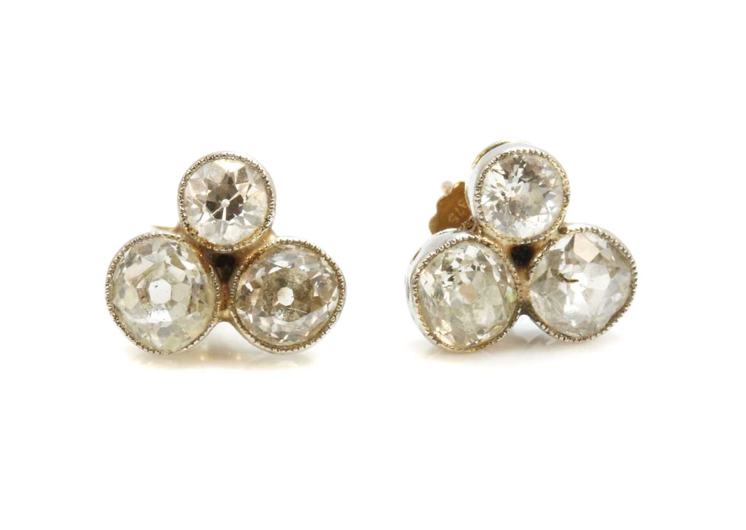 Lot 22 - A pair of trefoil diamond cluster stud earrings