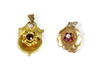 Lot 85 - A gold ruby and diamond flower pendant