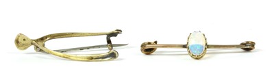 Lot 23 - A gold wishbone brooch