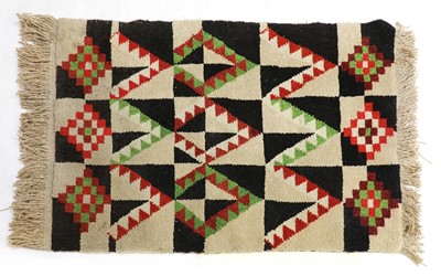 Lot 481 - A geometric rug